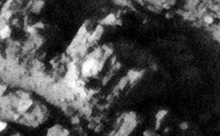 Destroyed machine or structure with small features on top to the left