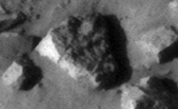 Triangular block with symbols/features on top