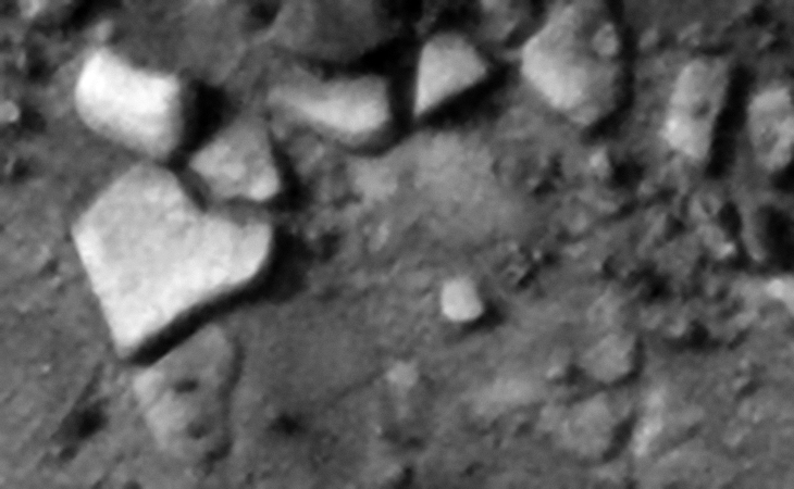 Strange heart-shaped slab to the left and smaller pieces with knobs to the right