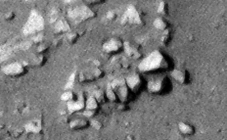 Close-up of the circular structure showing the megalithic blocks with knobs, note the parallel rows and uniform spacing of the blocks