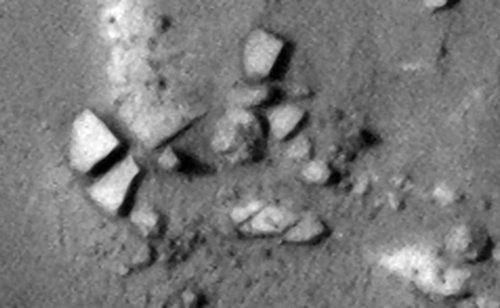 Close-up of the circular structure showing the megalithic blocks with knobs, note the parallel rows and uniform spacing of the blocks