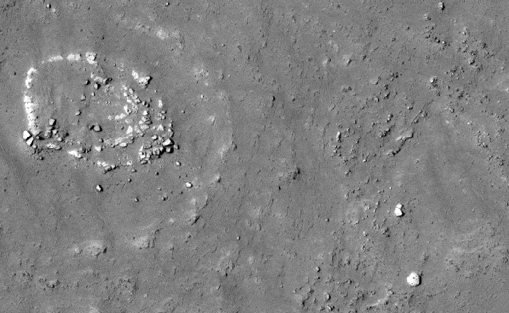 A zoomed-out view of a huge megalithic block near the circular structure
