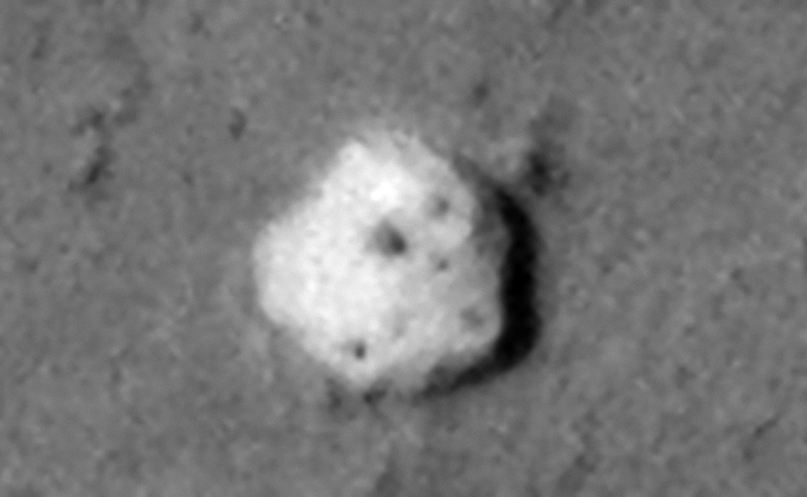 Close-up of the huge megalithic block, note the hexagonal shape and the small feature in the center. Three smaller dark features are seen near each corner