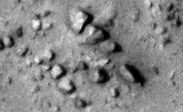 Two parallel rows of similar megalithic blocks uniformly spaced
