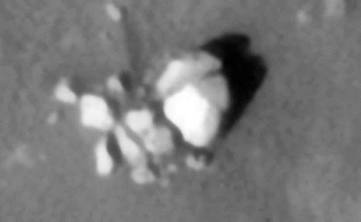 Destroyed statue pieces, perhaps part of the same object