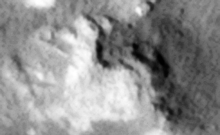 Two layered, circular steps with small dome-like feature in the center