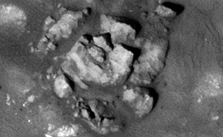 Destroyed multi-layered structure or statue