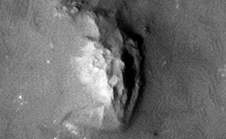 Underground entrance-way with narrow step at entrance