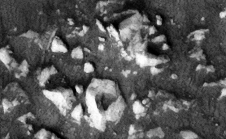 Destroyed structure, the triangular piece located in the middle bottom appears to have a triangular hole