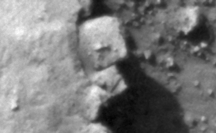 Two exposed, inter-locking megalithic blocks with knobs or smaller features on top