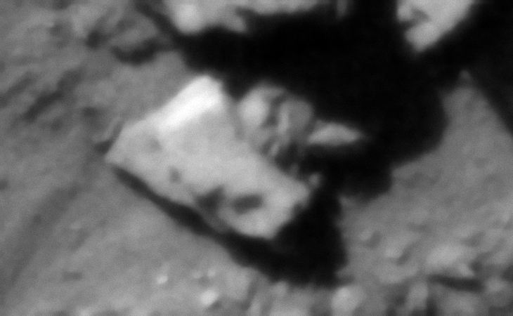 Megalithic block with multiple smaller features, perhaps part of a sculpture