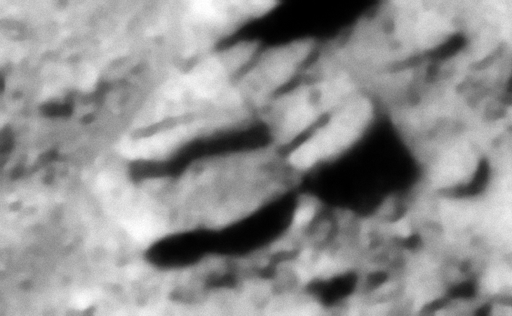 Layered/stepped megalithic blocks/slabs or some type of metallic-looking technology