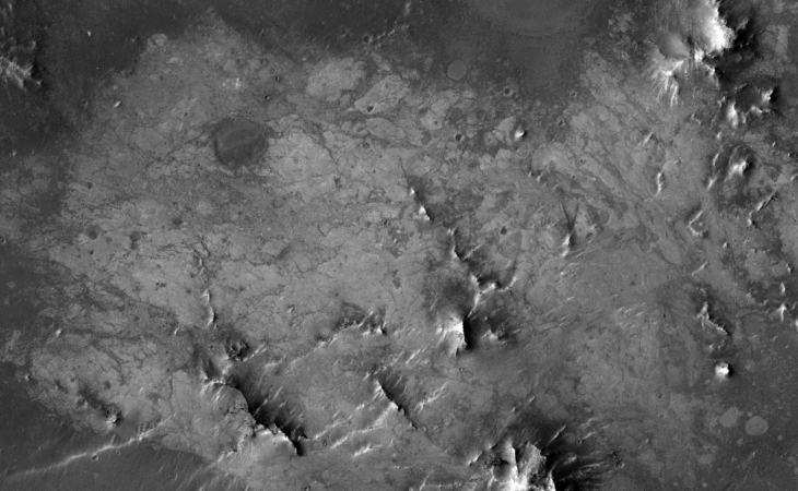 Strange surface features, perhaps some remnants of a city with circular dams?