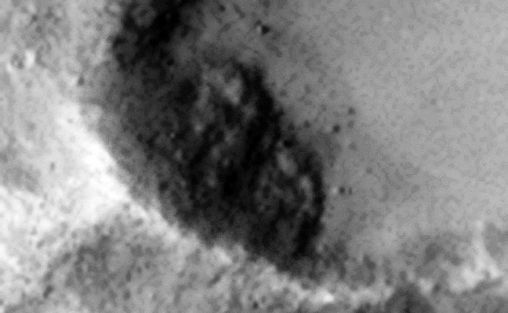 Symmetrical objects next to each other inside crater?