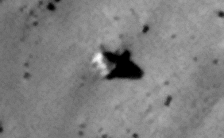 Rectangular megalith with small dome-like symbols?