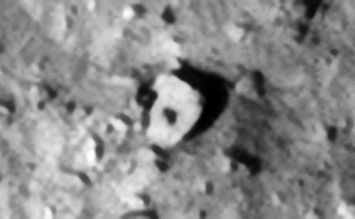 Megalith or metallic object? Another dome-like feature or knob is seen in the center