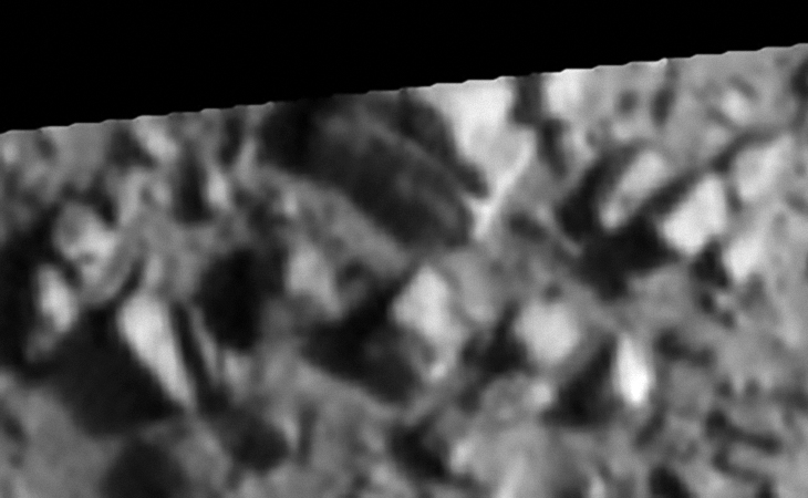 Structure rotated 180 degrees, note the rectangular base and strange rounded part on top. The shape of the structure looks like a mantle piece clock. Could that dark rectangular shape in the base be an entrance-way?