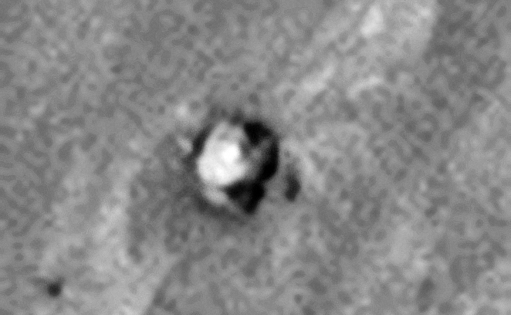 Saucer-shaped craft with triangular-shaped debris?