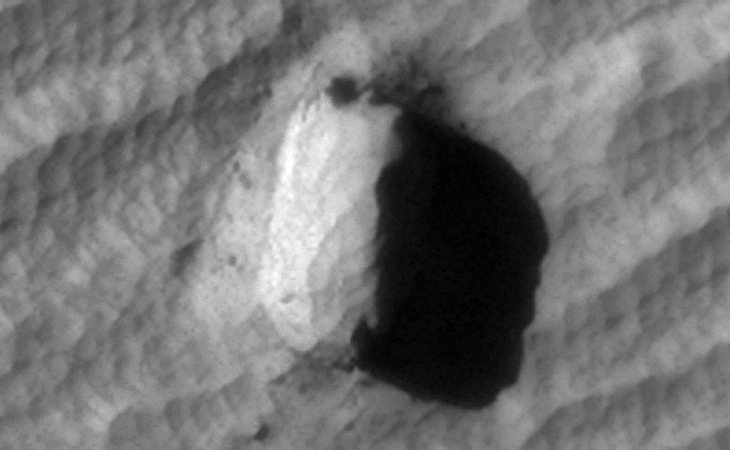 Megalithic block with rectangular slot or opening to the bottom right