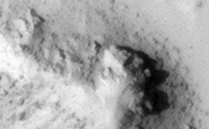 Mine or underground entrance-way? The surface looks machined