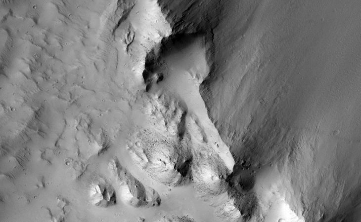 The surface area here looks as if it may have been 'worked' or mined, check out the long narrow area that extends to the bottom. Also to the bottom left is a triangular area that seems to have been hollowed out in the side of the rock face and in the middle-bottom a square