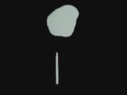 Phobos in the background with cigar-shaped object in the foreground photographed moments before Phobos 2 stopped working
